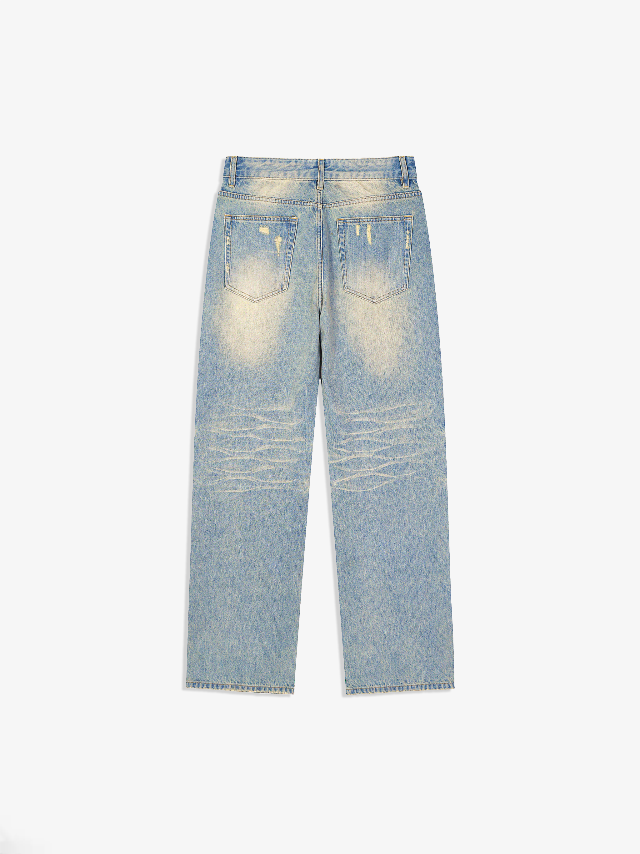 Light blue jeans with distressed details on a white background