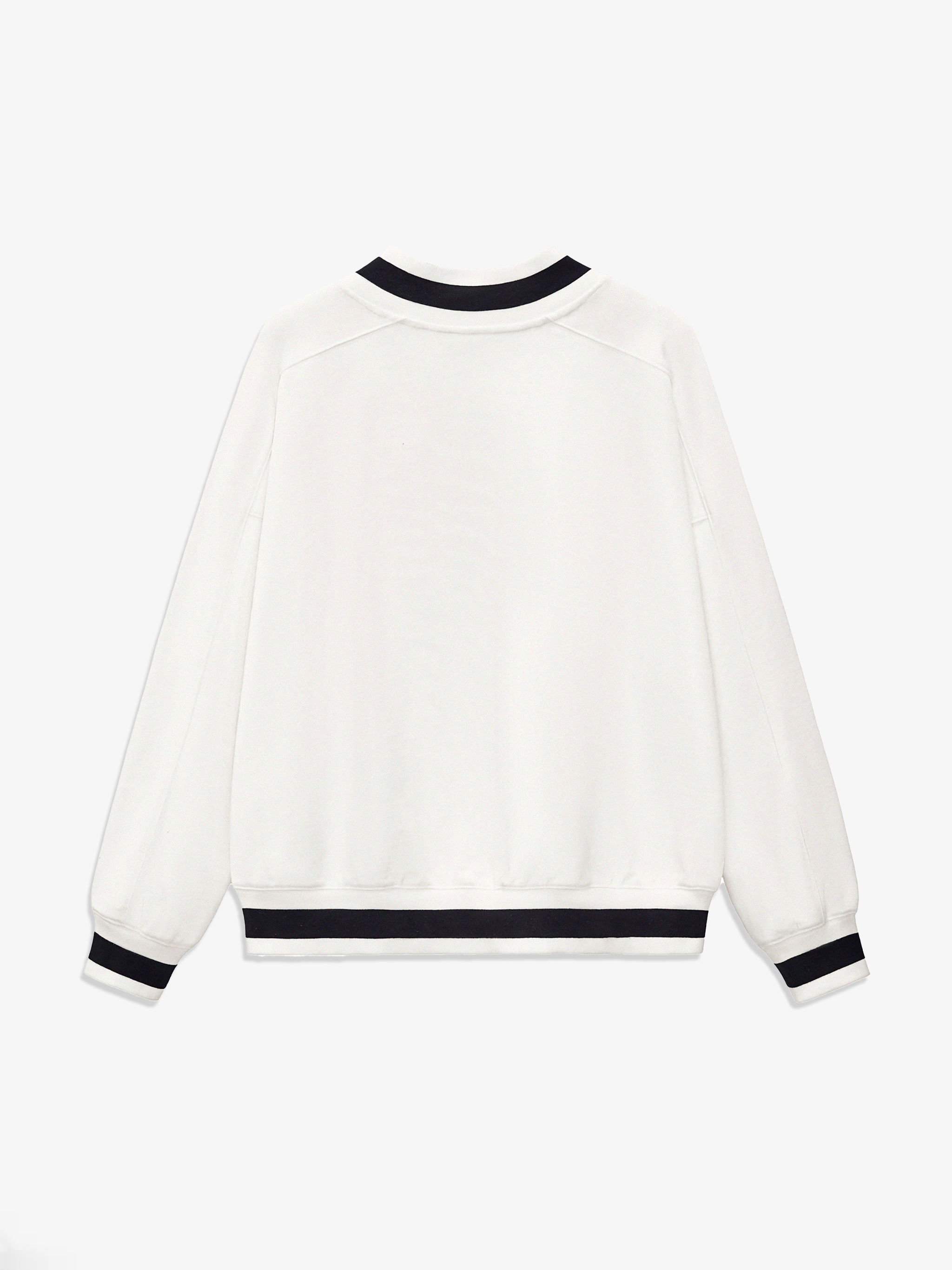 White sweater with black trim on a white background