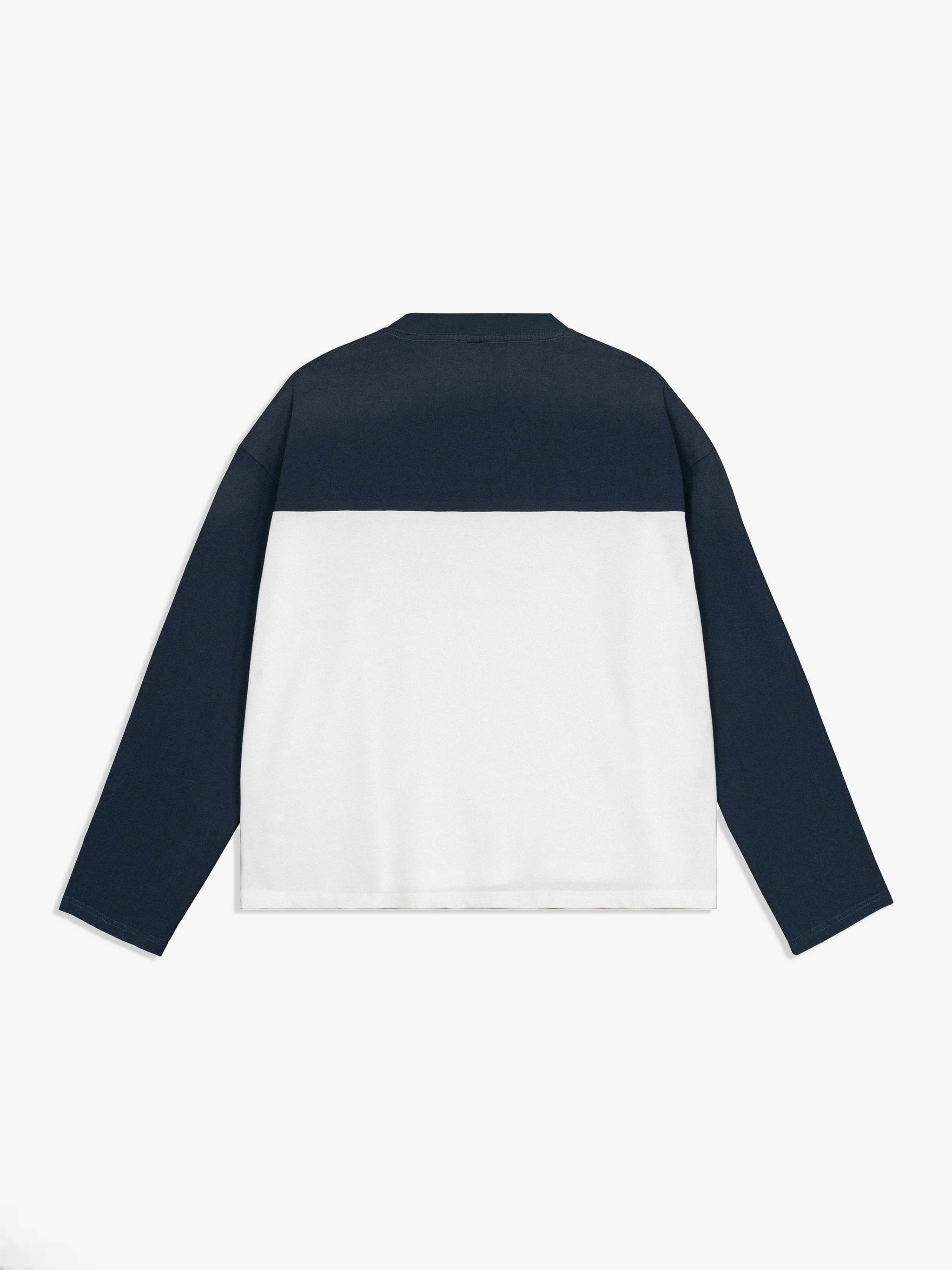 Two-tone navy and white jacket on a white background