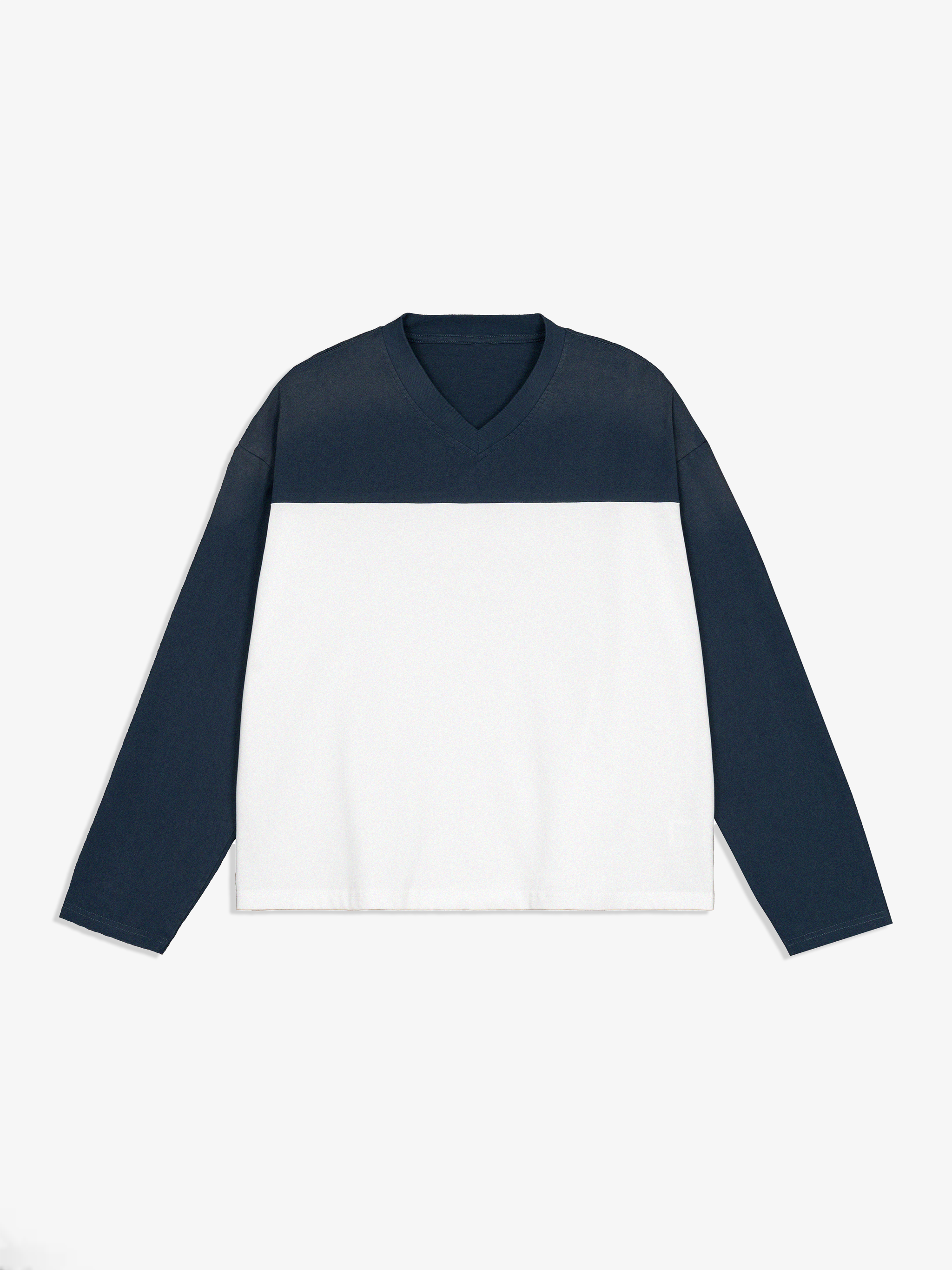 Navy and white long-sleeve shirt on a light gray background